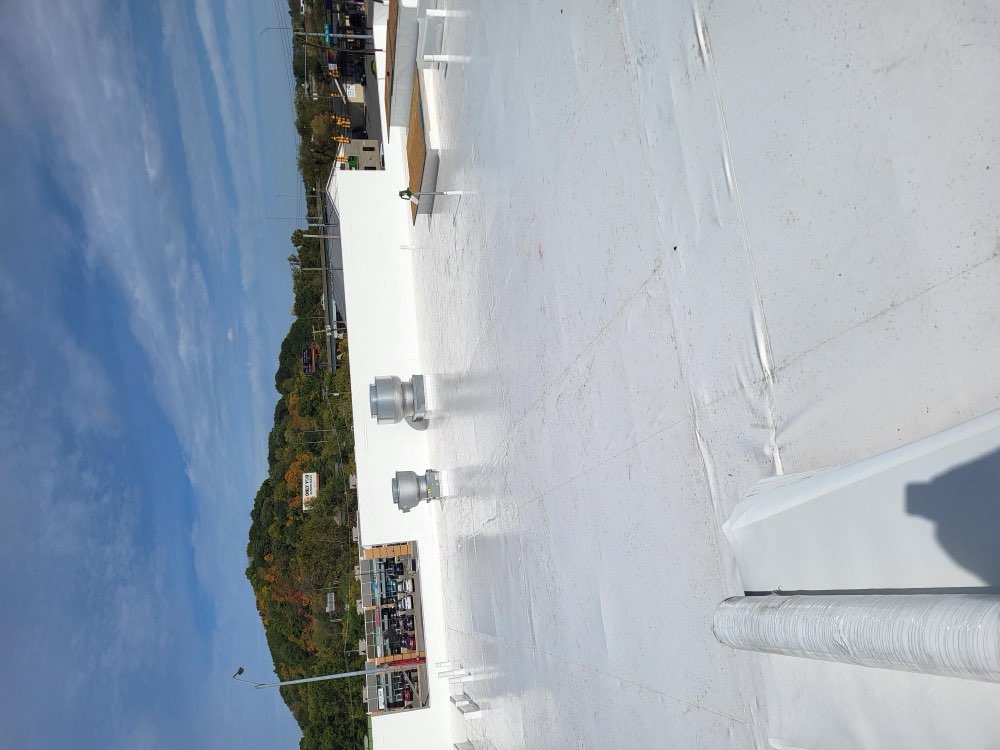 Commercial TPO roof with rooftop HVAC units installed